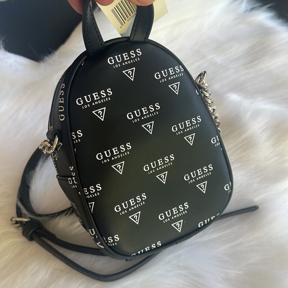 guess evan mini backpack Factory Women's Cross-body,Faux-Leather Material trim strap. Factory Evan Faux-fur Mini Crossbody
